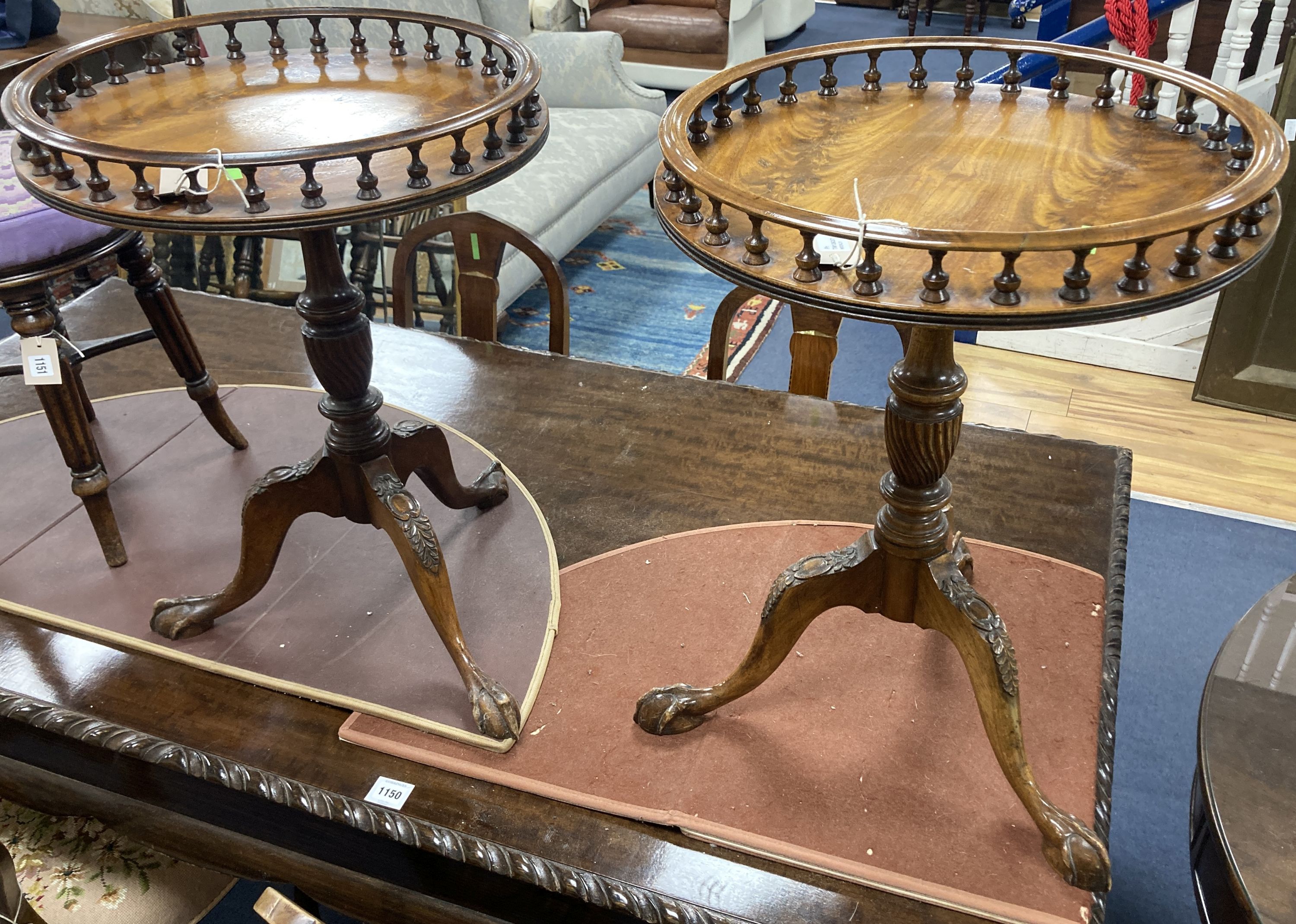 A pair of reproduction George III style mahogany galleried tripod wine tables, 48cm diameter, height 63cm